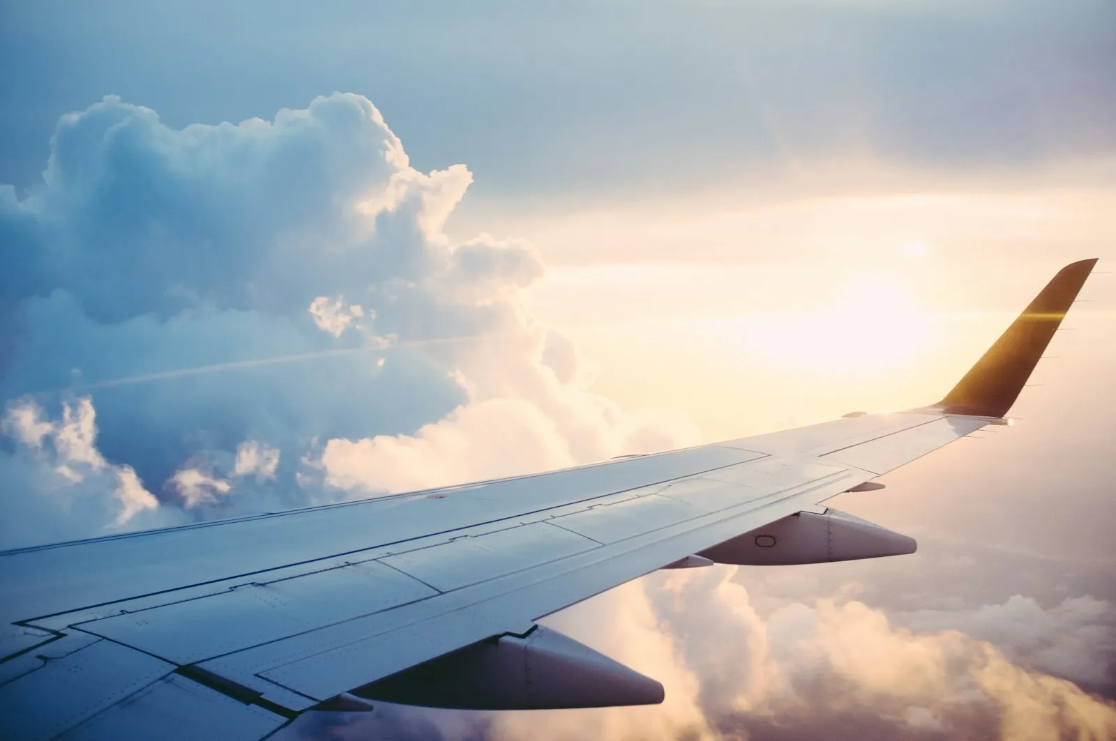 Aircraft wing in flight — travelling to China on business